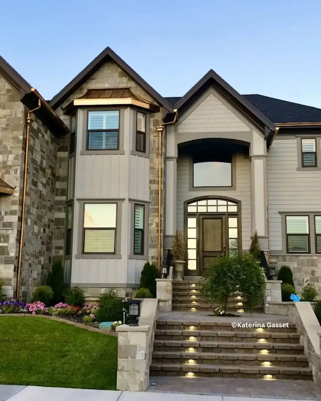 Stone building arched window with LLumar Specialty solar control window film