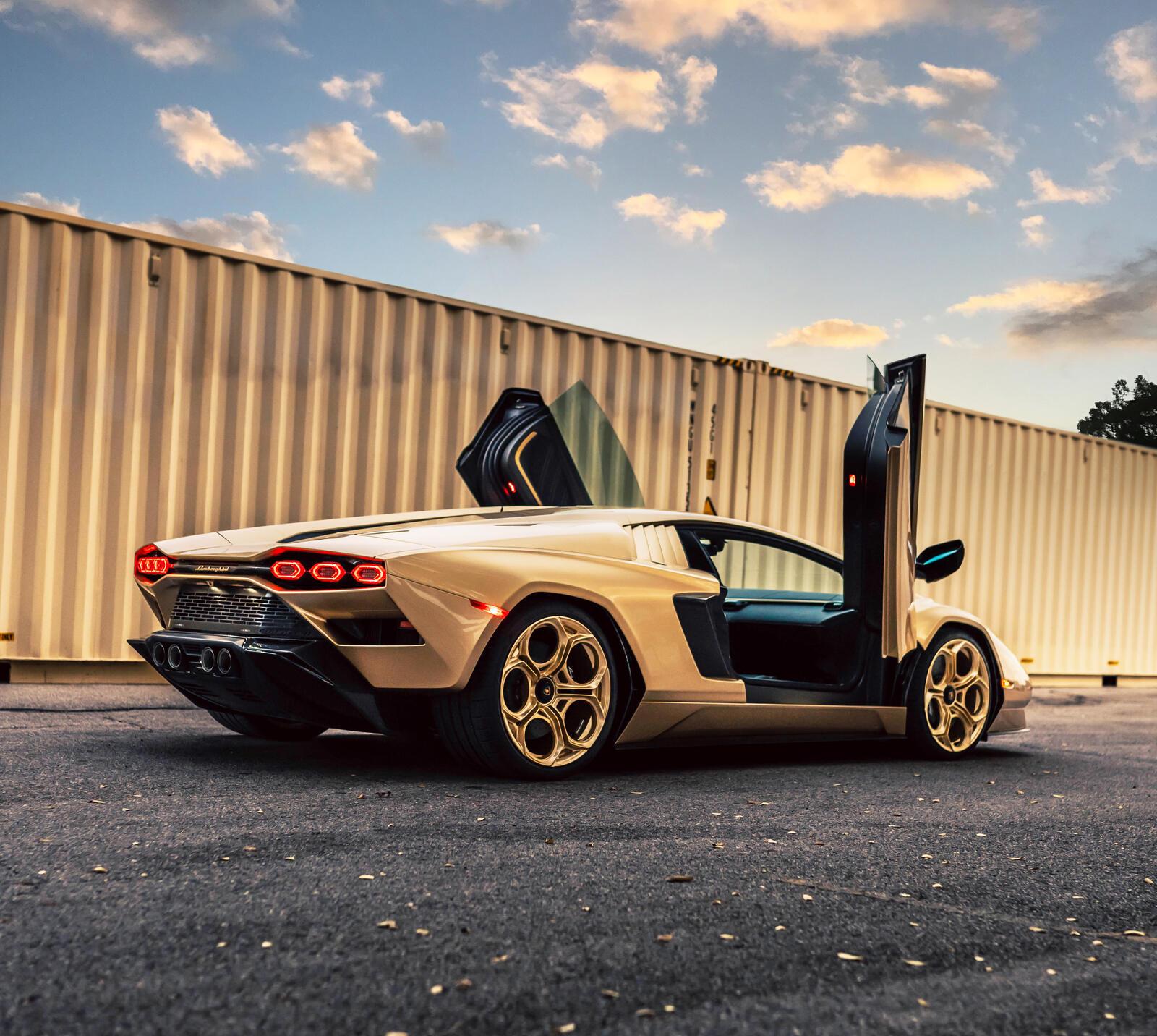Gold Lamborghini Countach rear three-quarter, doors up — ATC carbon look