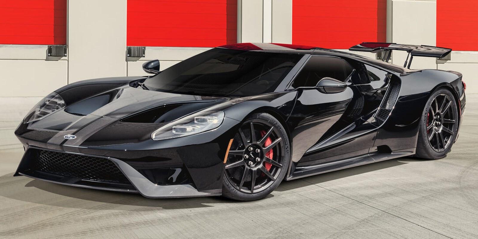 Black Ford GT front three-quarter against red roll-up doors — FormulaOne Pinnacle flagship